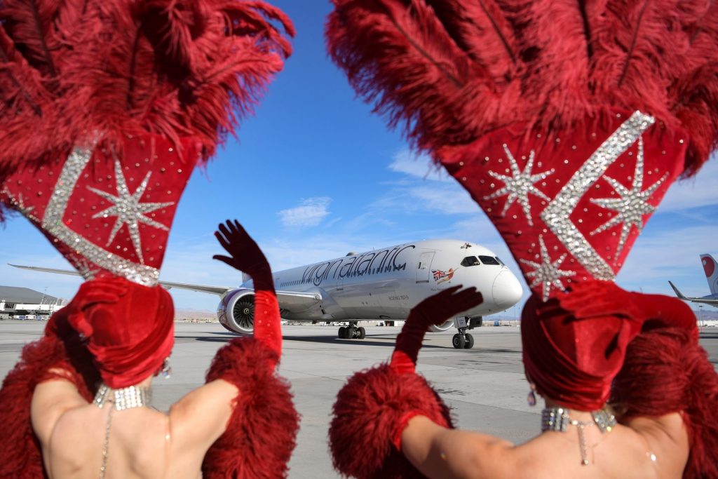 Las Vegas Showgirls welcoming international travelers flying in on Virgin Atlantic Ariways.
