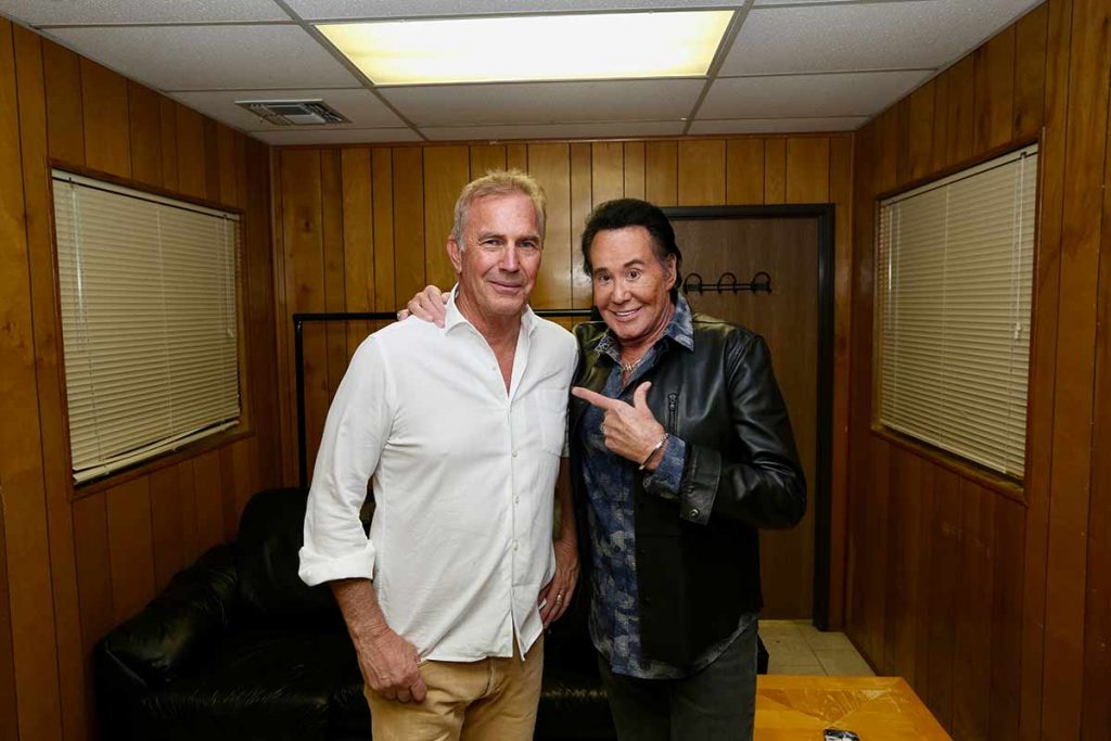 Kevin Costner and Wayne Newton pose for photo