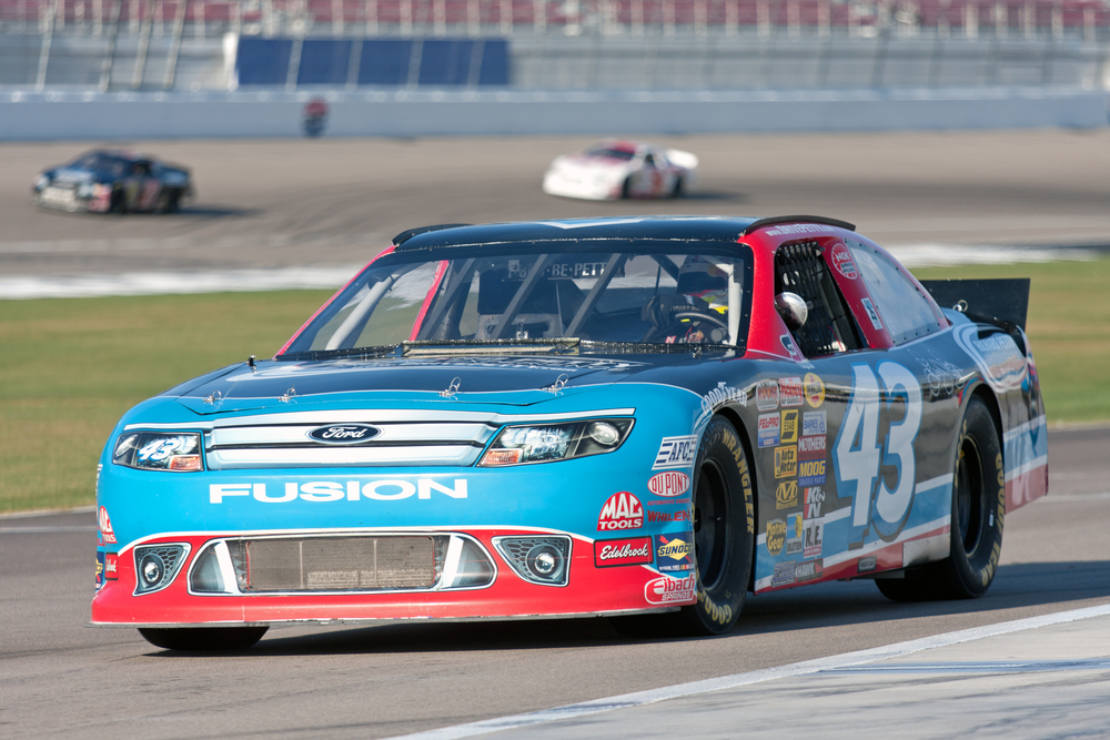 A person driving the #43 car at the Richard Petty Driving Experience at the Las Vegas Motor Speedway