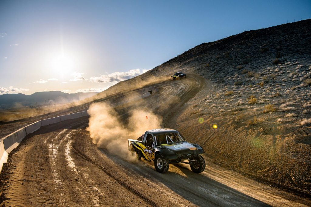 A Baja Race Truck drifting on an off-road course (Photo Courtesy of SPEEDVEGAS Motorsports Park)