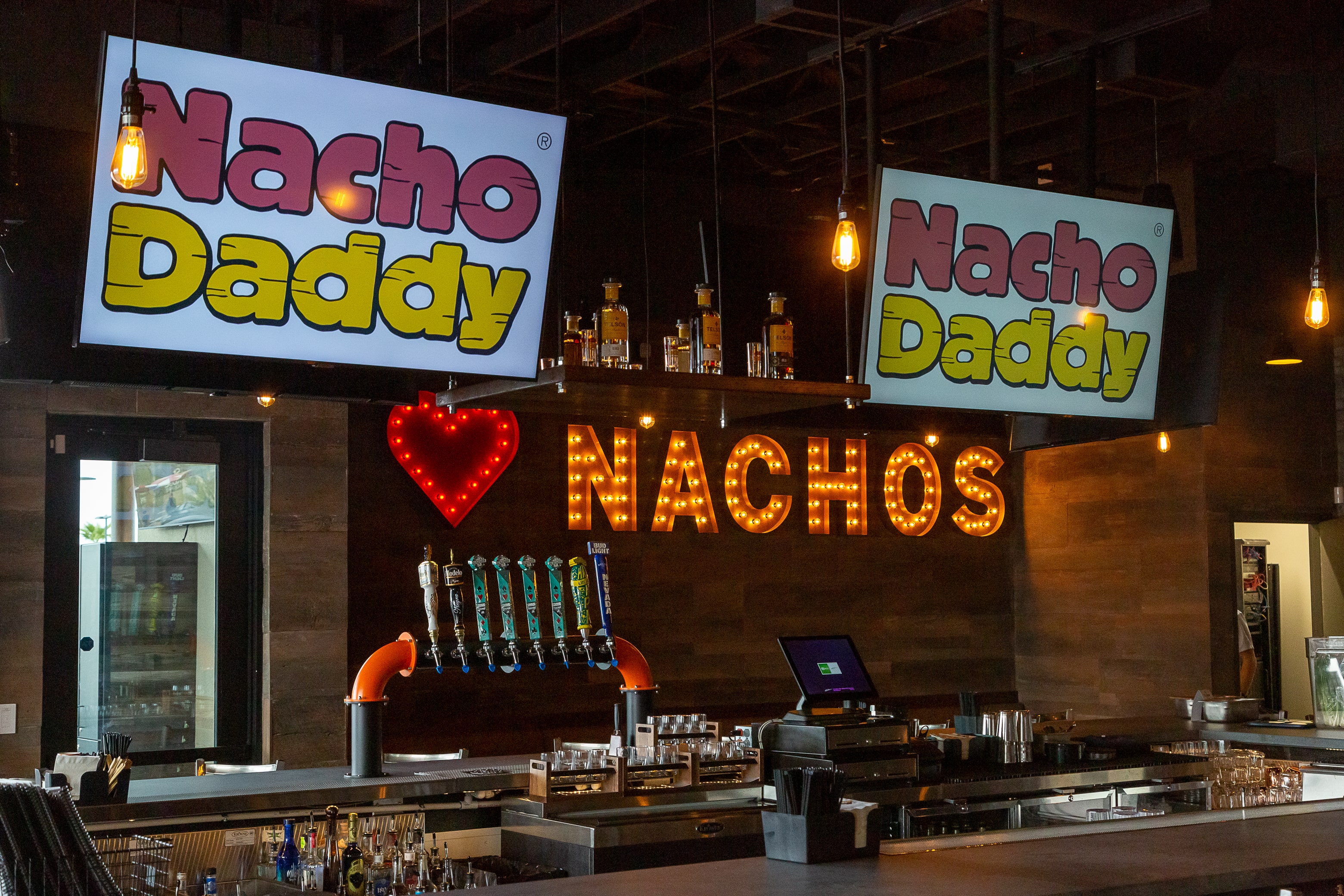 Nacho Daddy bar top and neon sign