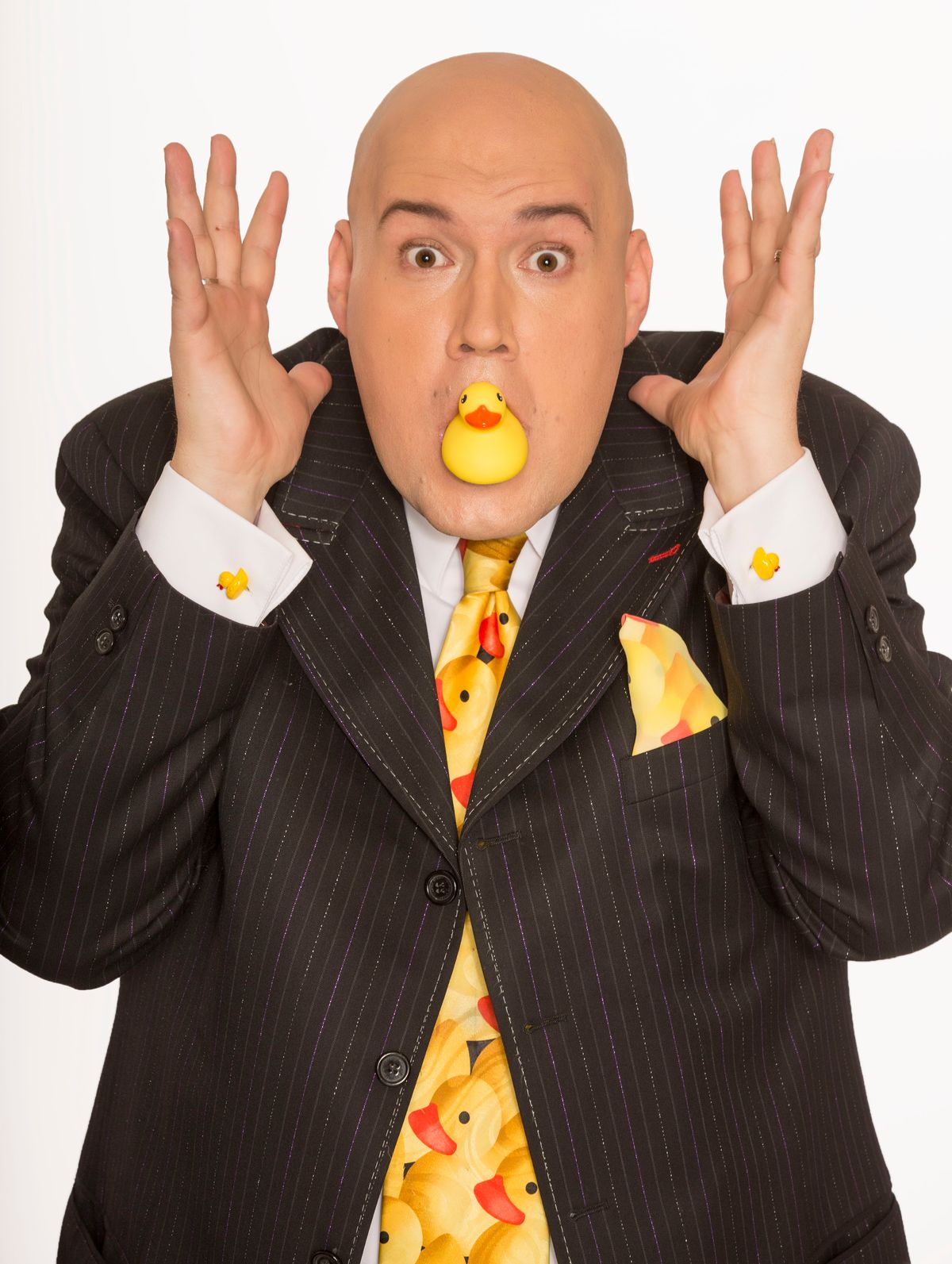 Adam London strikes a funny pose with rubber ducky in his mouth for Adam London Laughternoon show