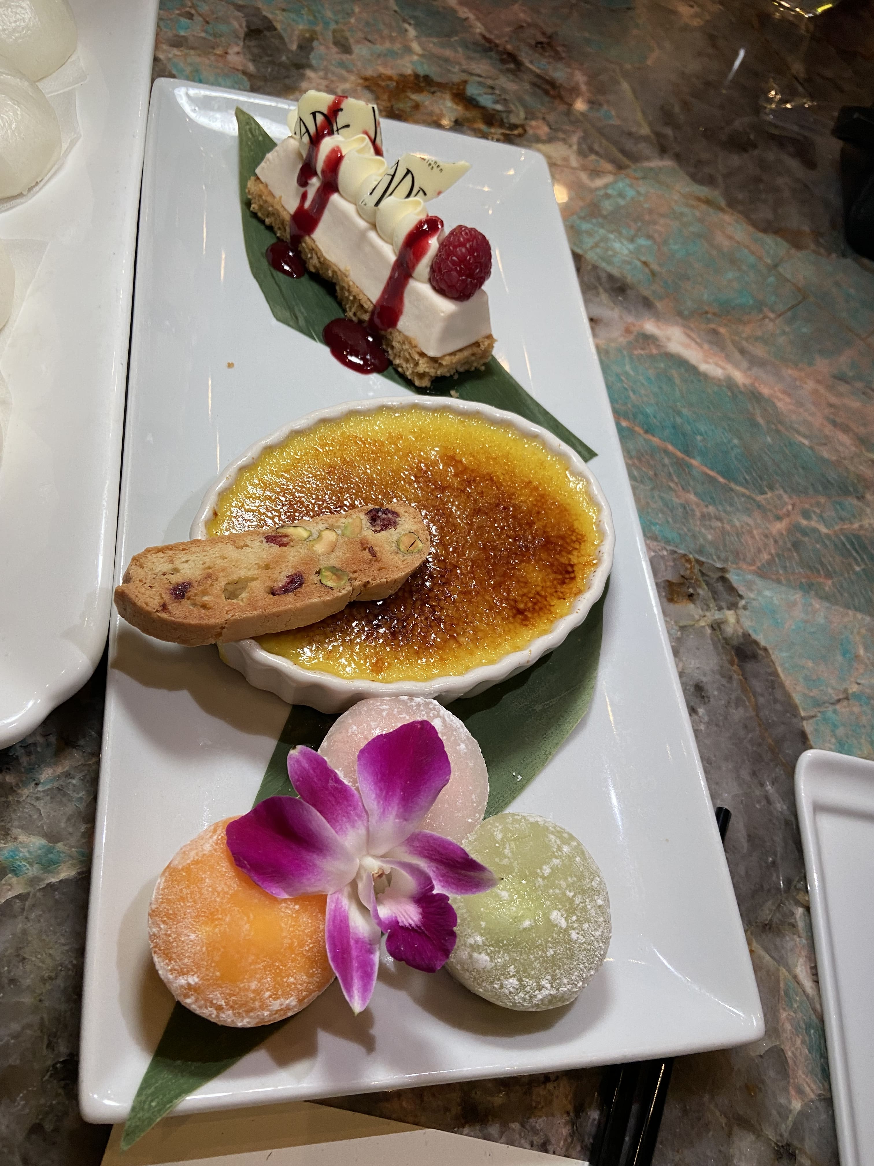 Jade trio dessert with matcha creme brulee, red bean cheesecake and mochi
