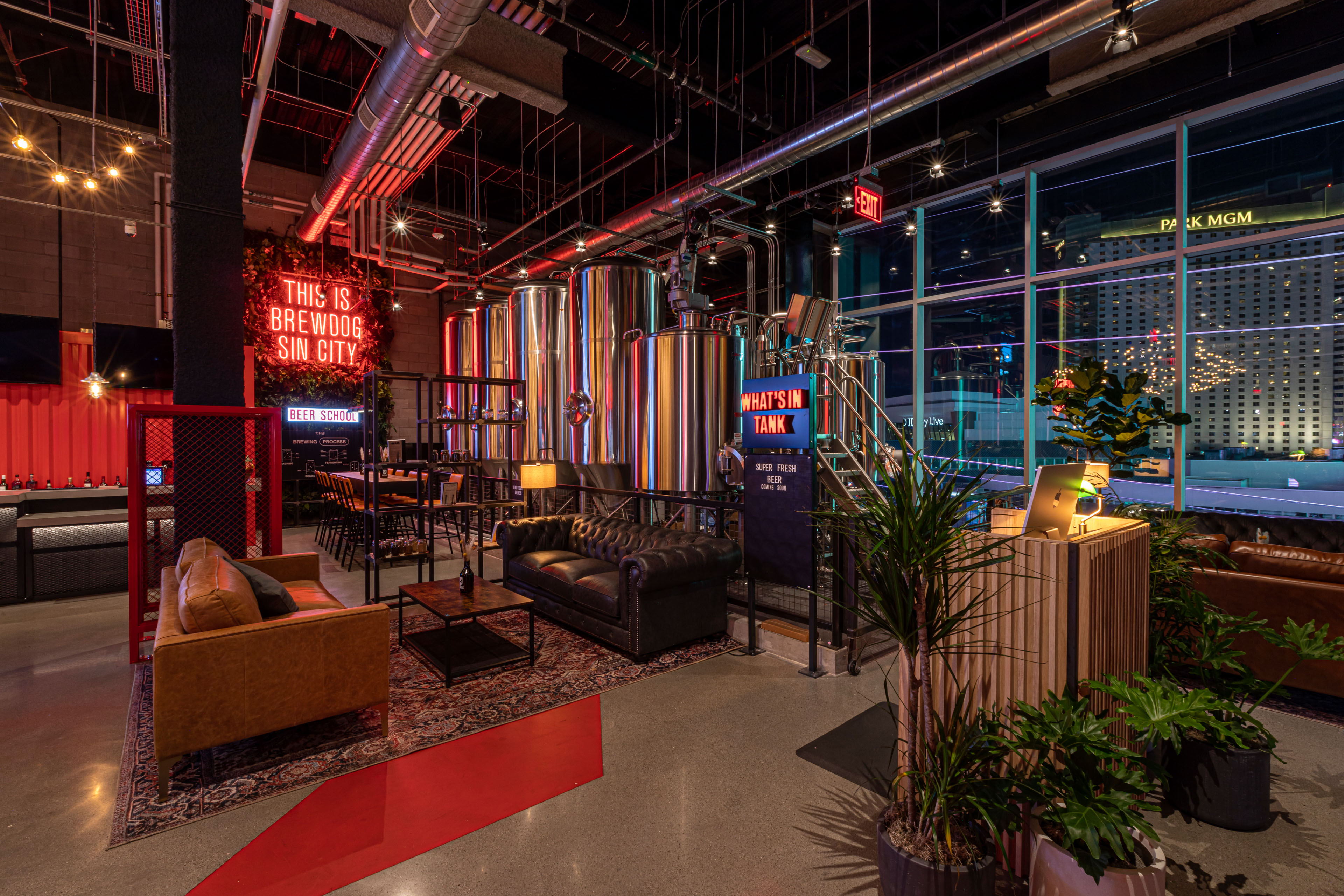 BrewDog interior with couches and neon signs
