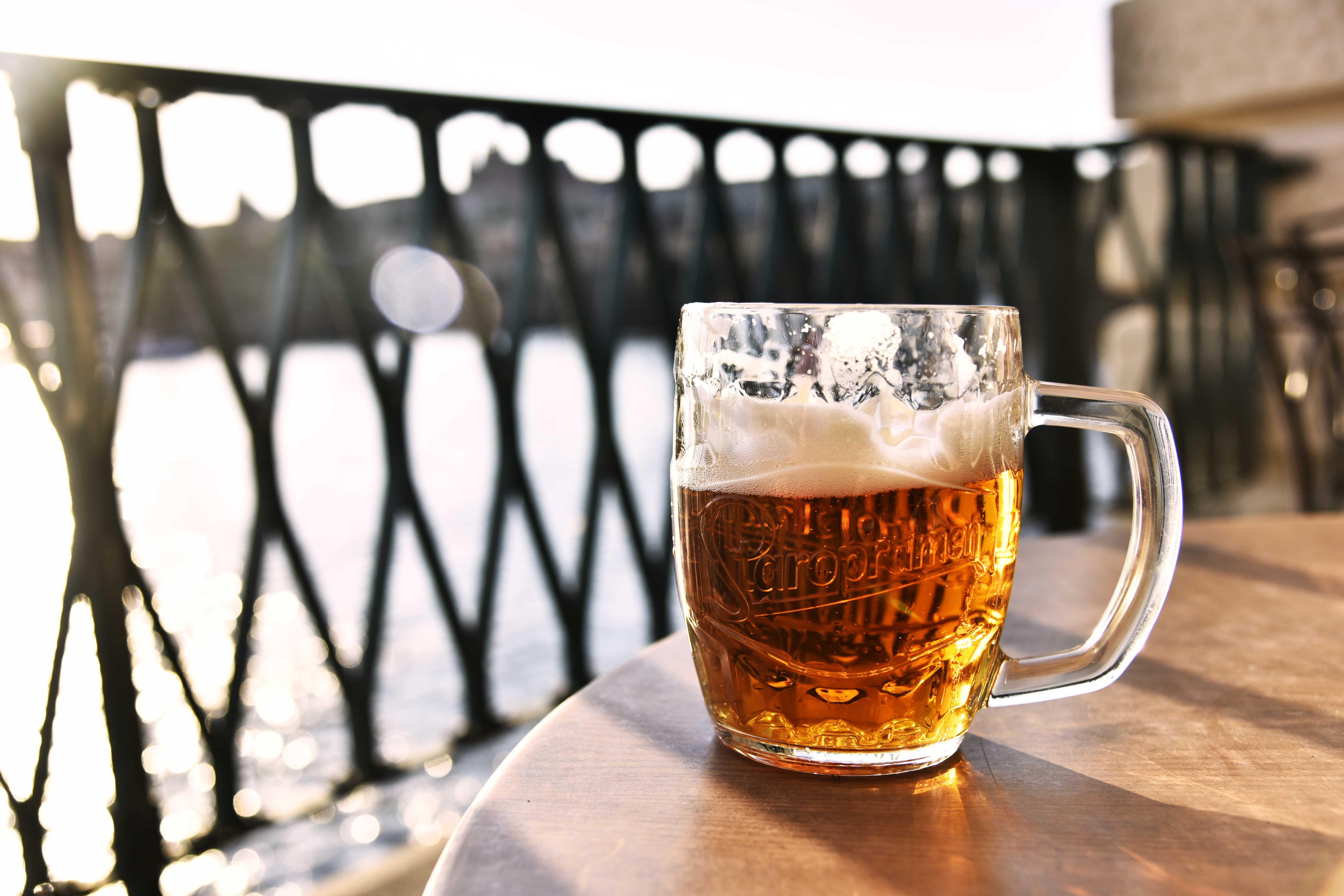beer on patio - visit local breweries new year's resolutions