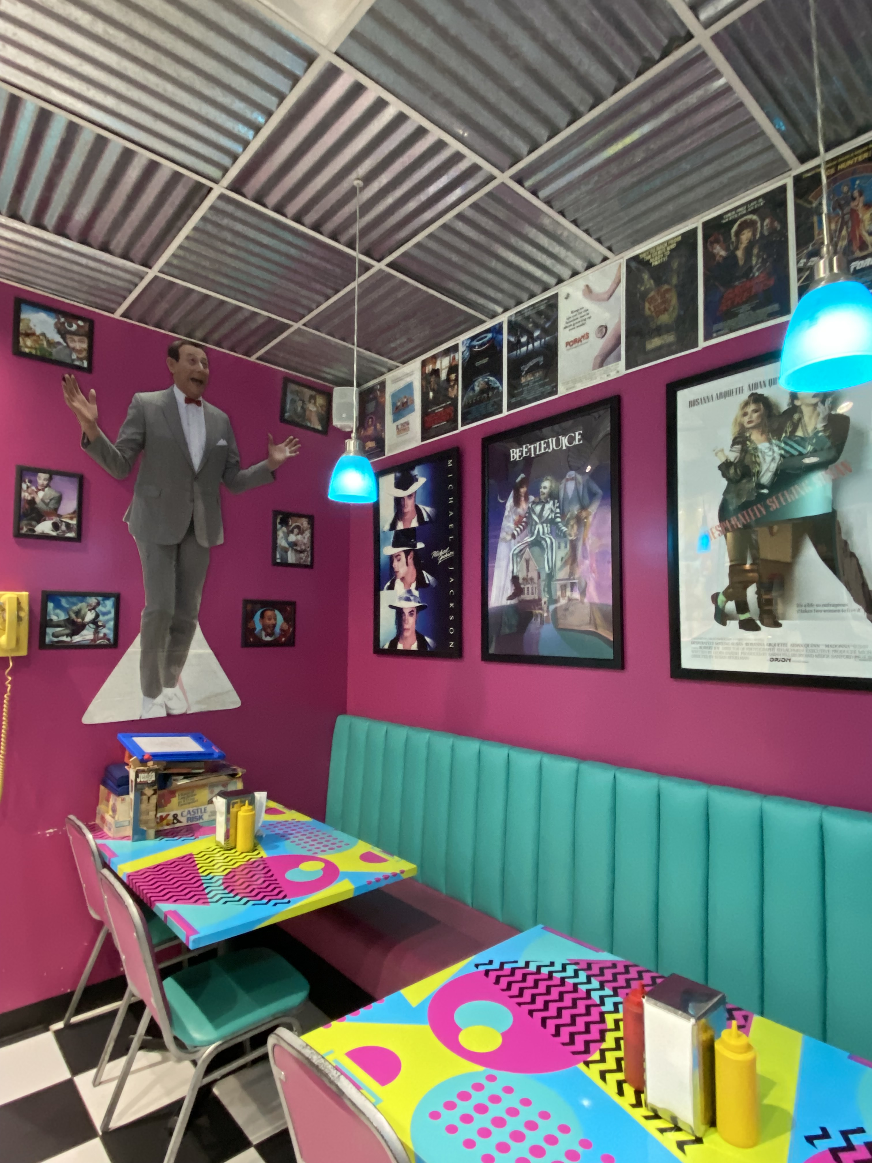 80s cafe dining area with eighties memorabilia - Pee Wee Herman, Beetlejuice, Michael Jackson and other retro decor 