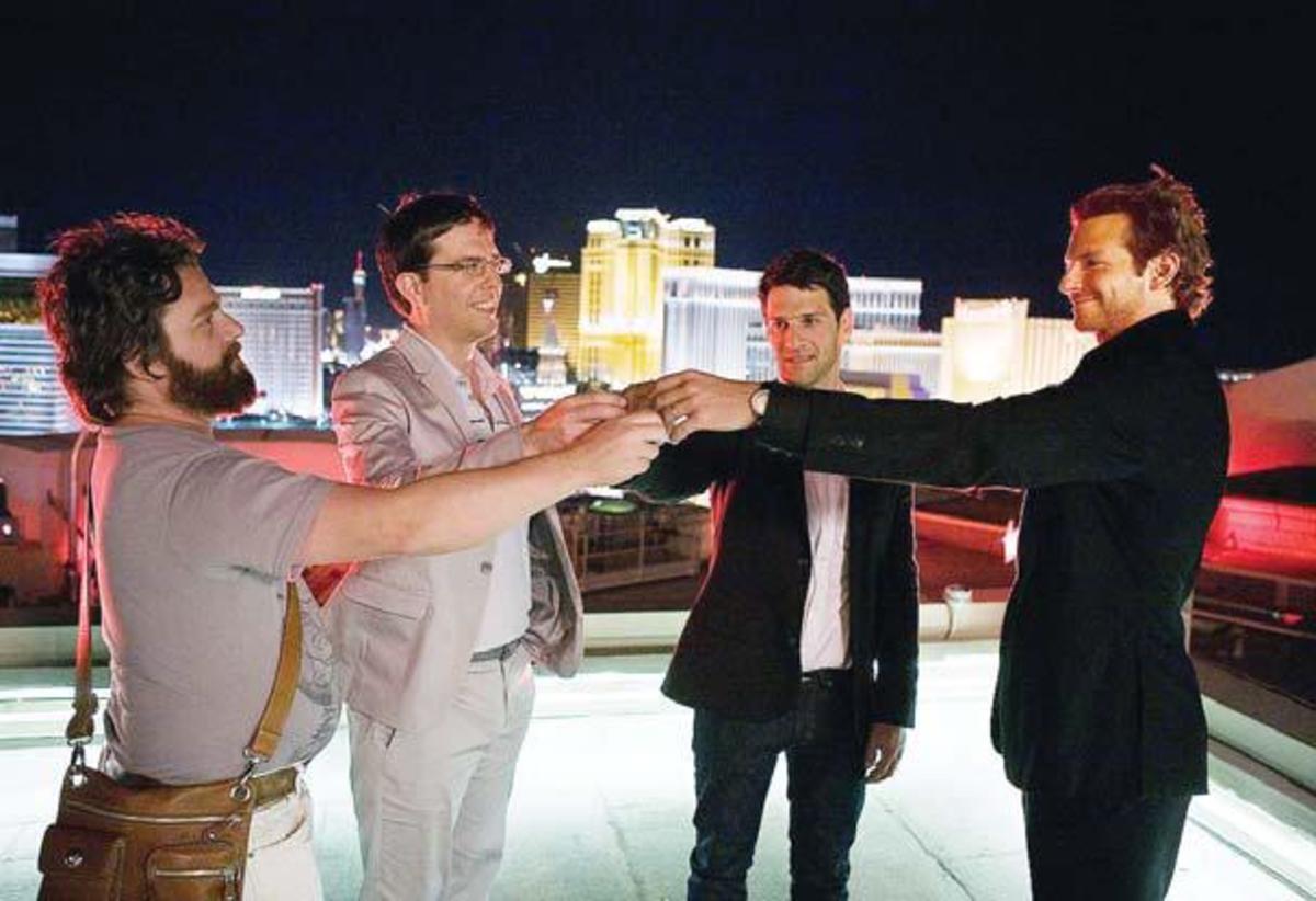 The Hangover movie scene with all bachelors on a Las Vegas rooftop raising a toast to their best friend
Bradley Cooper, Ed Helms, Justin Bartha and Zach Galifianakis