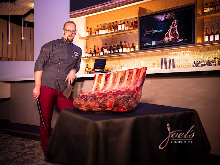 chef Joel with ribs at restaurant