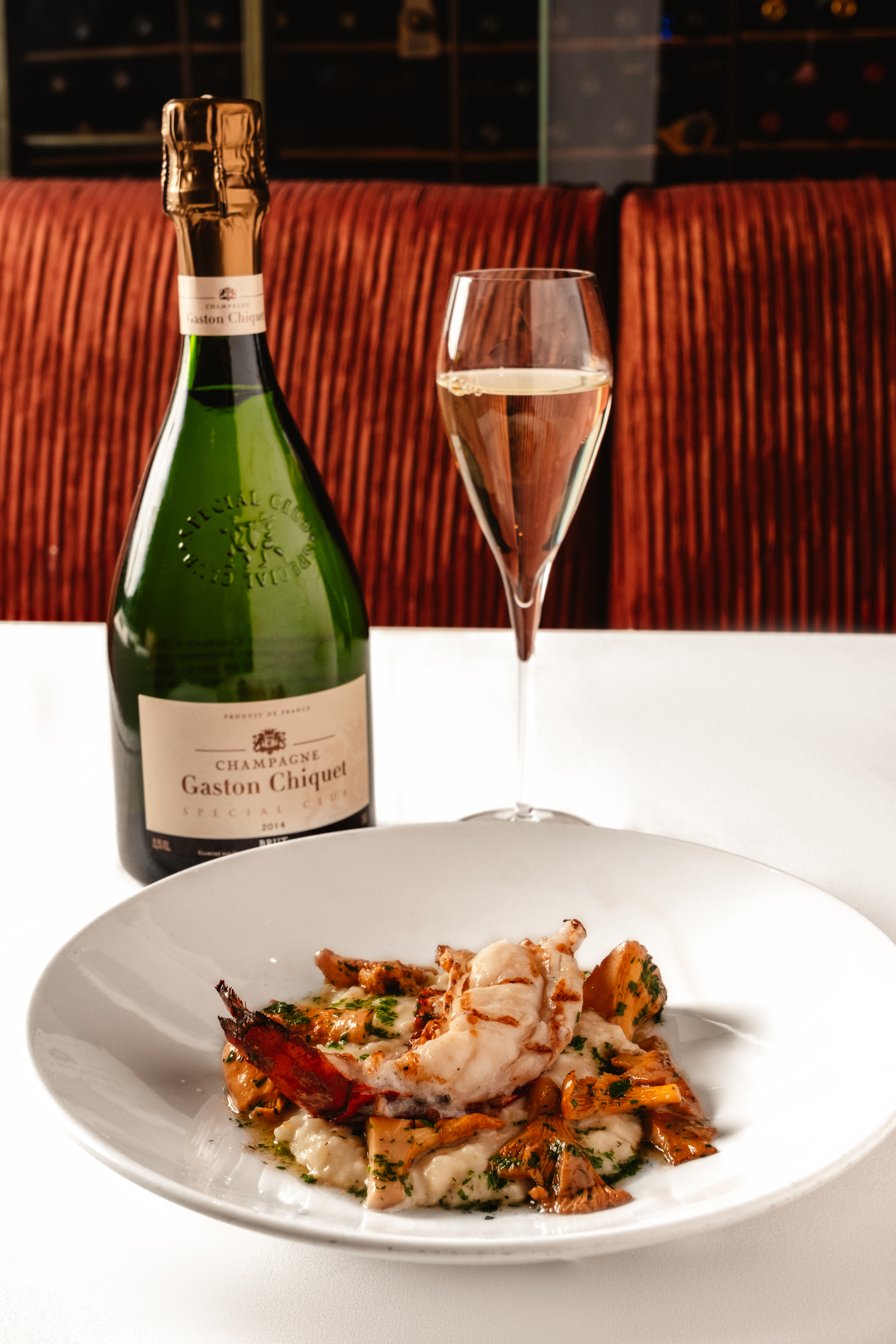 sparkling wine and seafood on a plate